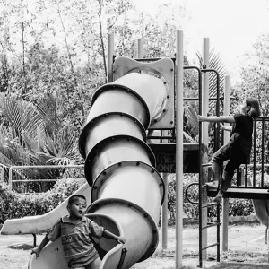 Boy coming out from tube