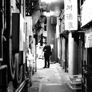 Businessman standing at the end of the alley