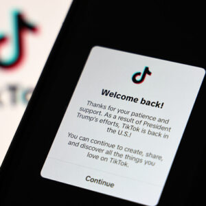 Image of a notice from TikTok on a black screen with a "Welcome back!" notice.