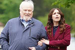 Christmas At The Holly Day Inn. Image shows left to right: Ben Holly (Colin Baker), Emma Holly (Tamla Kari)