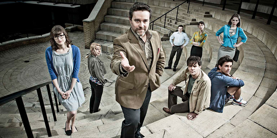 Campus. Image shows from L to R: Imogen Moffat (Lisa Jackson), Nicole Huggins (Sara Pascoe), Jonty de Wolfe (Andy Nyman), Jason Armitage (Will Adamsdale), Matt Beer (Joseph Millson), Lydia Tennant (Dolly Wells), Flatpack (Jonathan Bailey), Georgina 'George' Bryan (Katherine Ryan). Copyright: Monicker Pictures