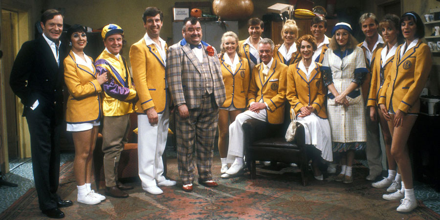 Hi-De-Hi!. Image shows from L to R: Sqdn-Ldr Clive Dempster DFC (David Griffin), Gladys Pugh (Ruth Madoc), Fred Quilly (Felix Bowness), Spike Dixon (Jeffrey Holland), Ted Bovis (Paul Shane), April Wingate (Linda Regan), Stanley Matthews (David Webb), Barry Stuart-Hargreaves (Barry Howard), Sylvia Garnsey (Nikki Kelly), Yvonne Stuart-Hargreaves (Diane Holland), Bruce Matthews (Tony Webb), Peggy Ollerenshaw (Su Pollard), Gary Bolton (Chris Andrews), Dawn Freshwater (Laura Jackson). Copyright: BBC