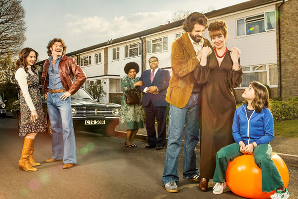 The Kennedys. Image shows from L to R: Jenny (Emma Pierson), Tim (Harry Peacock), Dee Palmer (Shola Adewusi), David Palmer (Clive Rowe), Tony Kennedy (Dan Skinner), Brenda Kennedy (Katherine Parkinson), Emma Kennedy (Lucy Hutchinson). Copyright: BBC