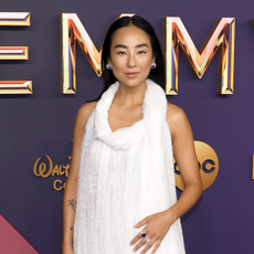 Greta Lee attends the 76th Primetime Emmy Awards at Peacock Theater on September 15, 2024 in Los Angeles, California wearing a white loewe gown