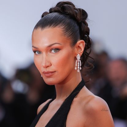  Bella Hadid attends the "L'Amour Ouf" (Beating Hearts) Red Carpet at the 77th annual Cannes Film Festival at Palais des Festivals on May 23, 2024 in Cannes, France. 