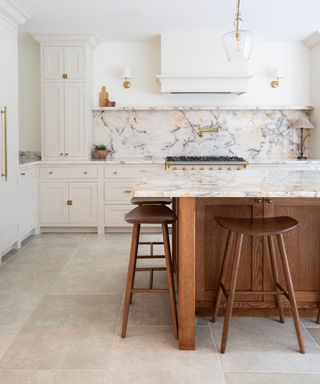 A white marbled kitchen with porcelain flooring