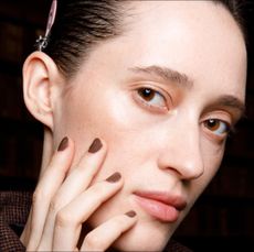 A model poses in the backstage of the Giada fashion show during the Milan Fashion Week - Spring / Summer 2022 on September 22, 2021 in Milan, Italy. 