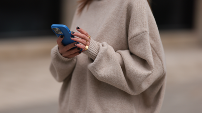 Elise Seitz seen wearing Soho Studios beige oversized wool knit sweater, on April 20, 2024 in Hamburg, Germany. (Photo by Jeremy Moeller/Getty Images)