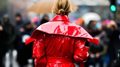 Marie Claire woman wearing bright red jacket