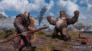 Games like God of War Ragnarok: Kratos fighting a giant monster on a mountain top.