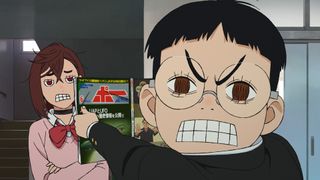 A still of Okarun showing Momo an alien journey in episode 1 of the Dan Da Dan anime