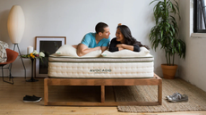 two people lying on top of an avocado mattress mattress