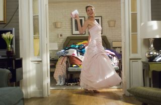 Katherine Heigl wears a pink dress in the movie 27 Dresses