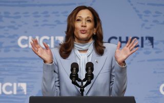 Kamala Harris appearing on the campaign trail in a powder blue suit