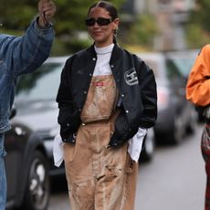 woman wearing overalls with jacket 