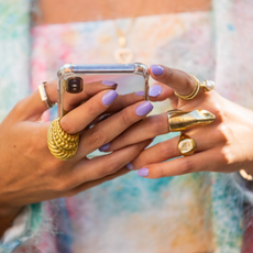 A guest is seen with phone jewelery outside Fendi during the Milan Women's Fashion Week on September 23, 2020 in Milan, Italy. 