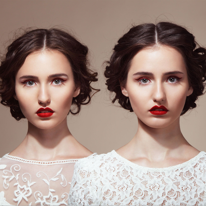 Two Identical Women in Slightly Different White Dresses