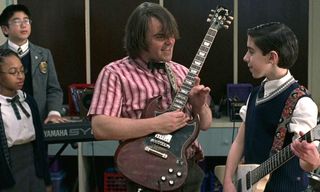 Jack Black plays a guitar in 'School of Rock'