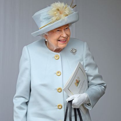 Queen Elizabeth in blue at a royal wedding