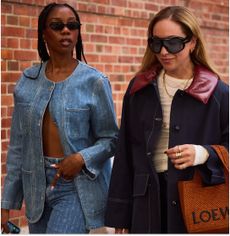 two women in denim jackets and fall clothing in Copenhagen 