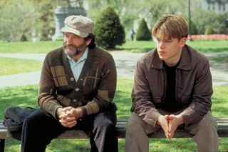 Robin Williams and Matt Damon sit on a bench in the movie 'Good Will Hunting'