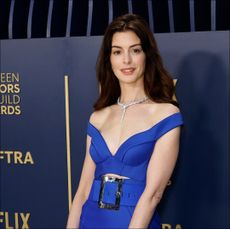 Anne Hathaway gives a subtle nod to 'The Devil Wears Prada' on the 2024 SAG Awards Red Carpet. 