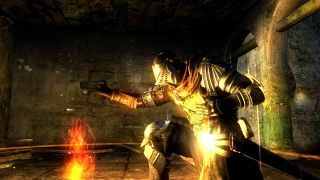 A player at a bonfire in Dark Souls