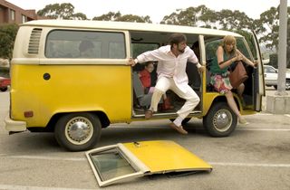 Steve Carrell and Toni Collette jump out of a yellow van in 'Little Miss Sunshine'