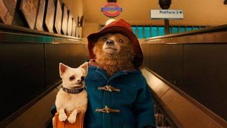 paddington and his dog friend in the tube in paddington 2