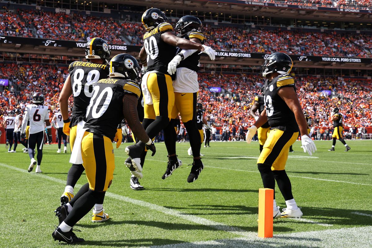 Darnell Washington #80 of the Pittsburgh Steelers celebrates a touchdown during the first half against the Denver Broncos at Empower Field At Mile High on September 15, 2024 in Denver, Colorado.