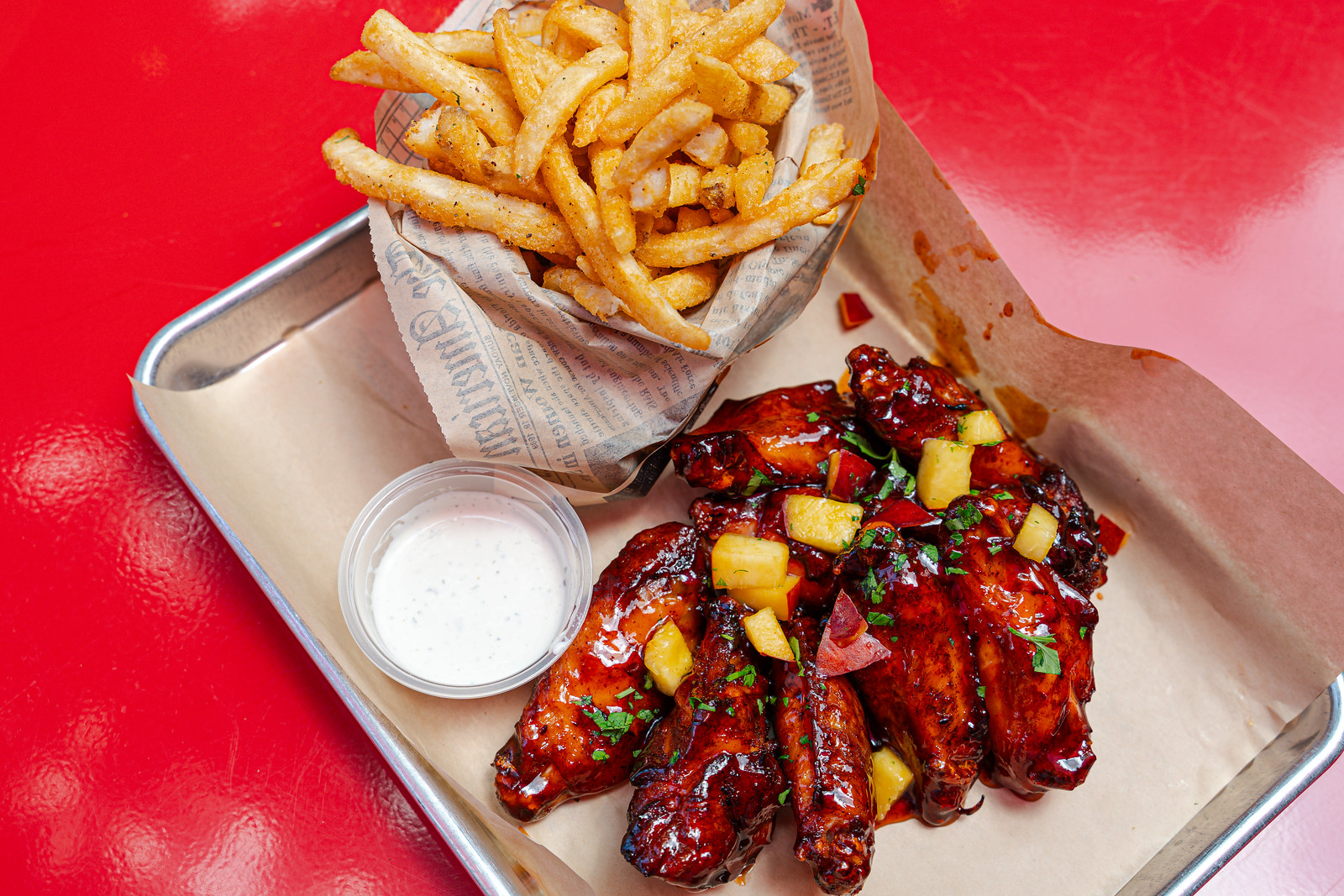 A platter of wingers and fries.