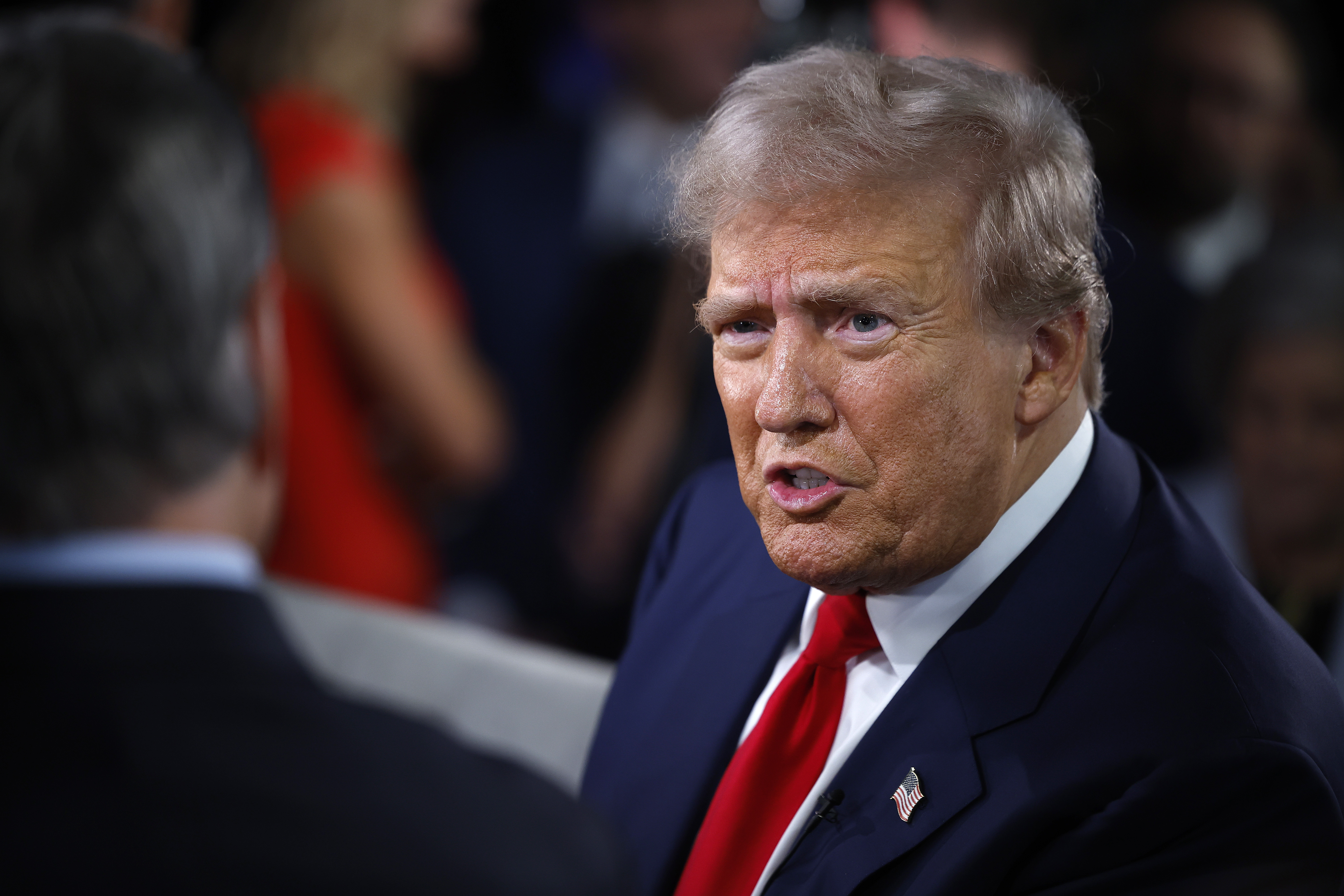 &nbsp;Republican presidential nominee, former President Donald Trump talks with FOX News host Sean Hannity in the spin room after Trump debated Democratic presidential nominee, U.S. Vice President Kamala Harris at The National Constitution Center on September 10, 2024 in Philadelphia, Pennsylvania