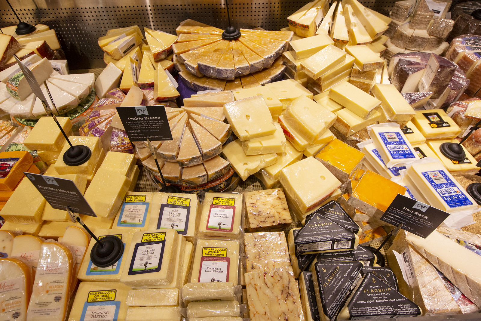 A cheese case filled with cheese.