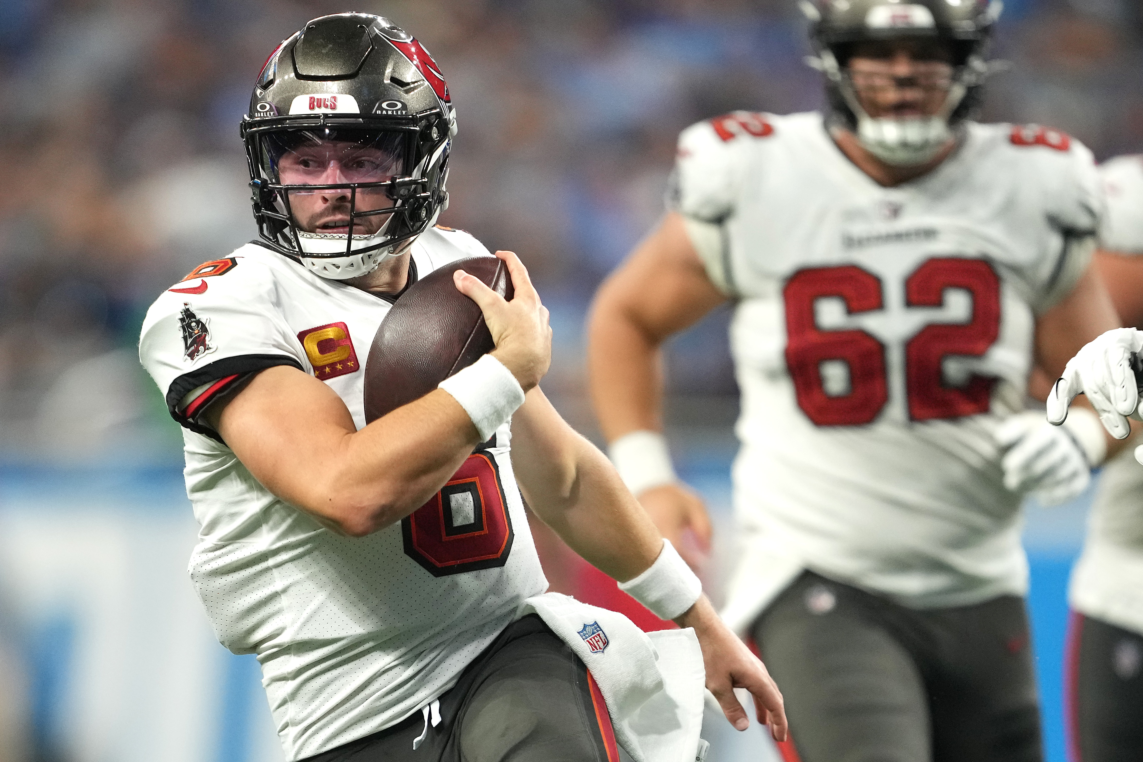 Quarterback Baker Mayfield #6 of the Tampa Bay Buccaneers runs with the ball against the Detroit Lions during the third quarter at Ford Field on September 15, 2024 in Detroit, Michigan.