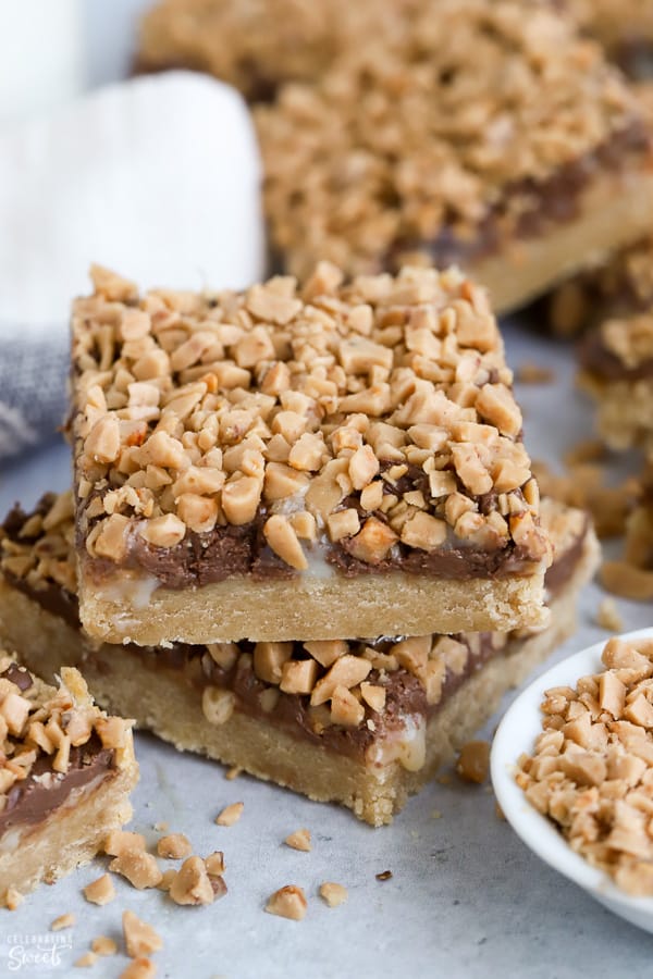 Two cookie bars topped with chocolate and toffee bits.