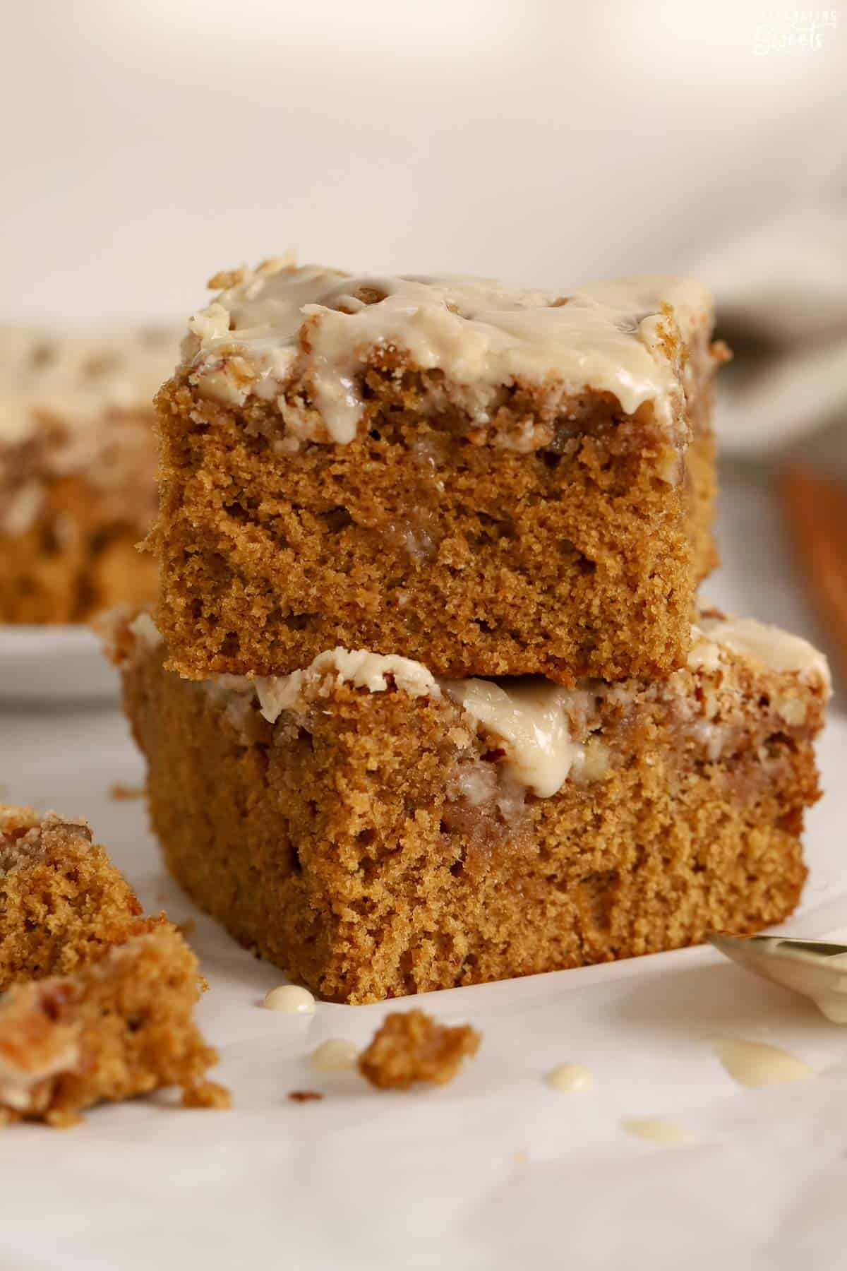 Two pieces of gingerbread cake stacked on top of each other.