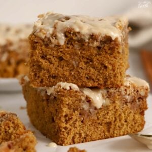 Two pieces of gingerbread cake stacked on top of each other.