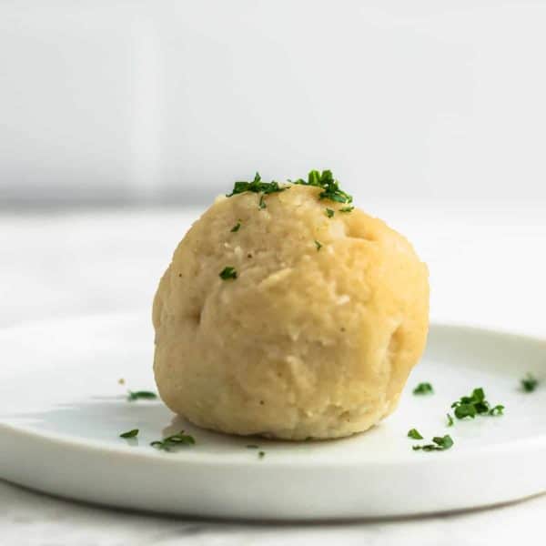 German Potato Dumplings - Kartoffelklösse on a white plate.