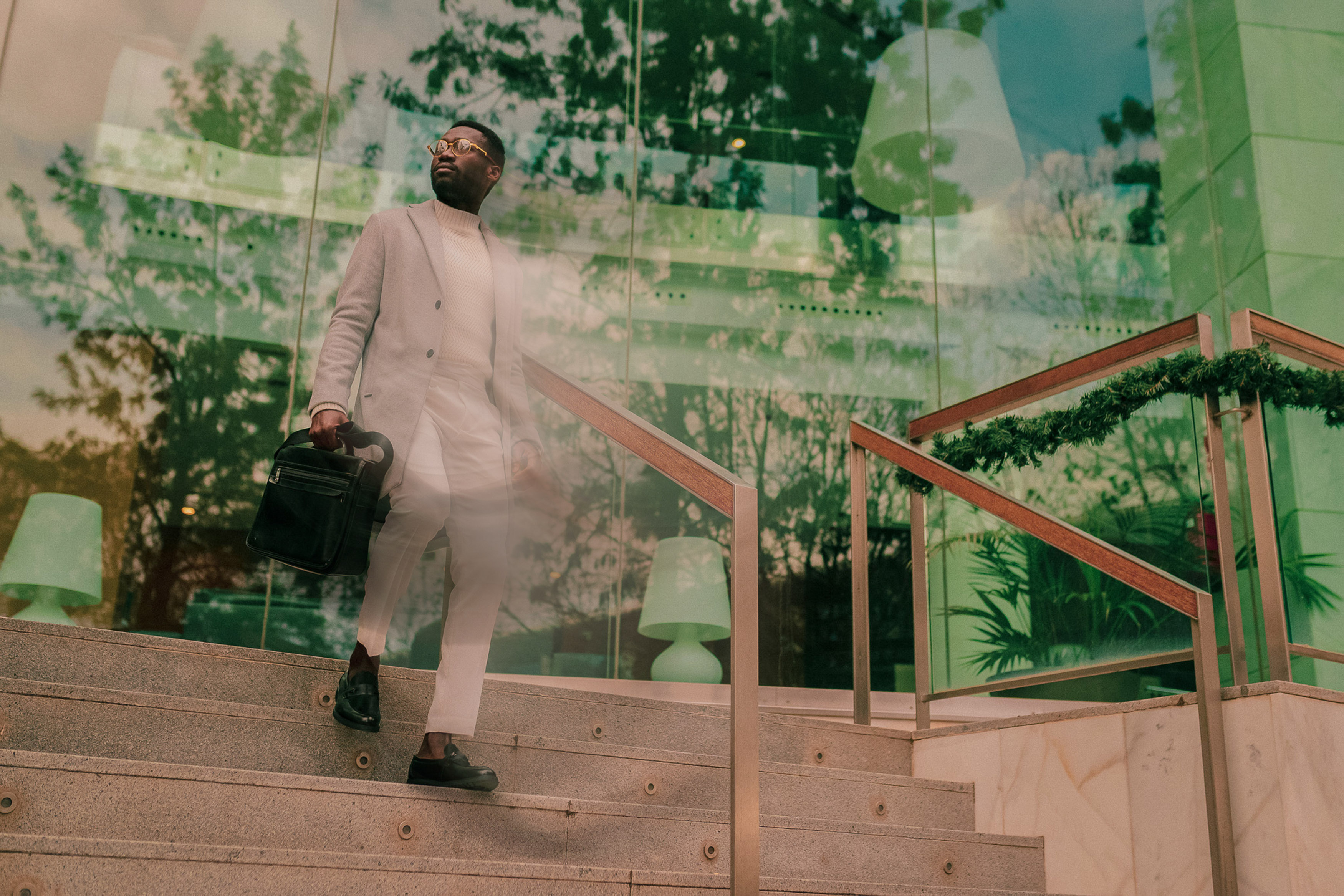 man walking down stairs looking sideways