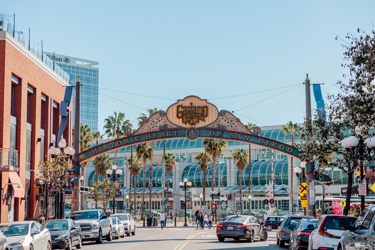 Gaslamp Quarter is a must with a weekend in San Diego itinerary. View from the middle of the street with the over arching Gaslamp sign