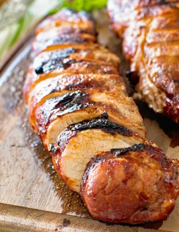 grilled pork loin slices on cutting board