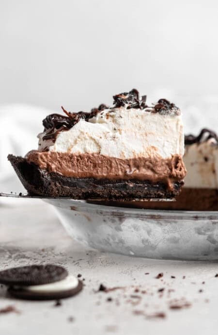 A slice of Mississippi mud pie being lifted from the pie to serve