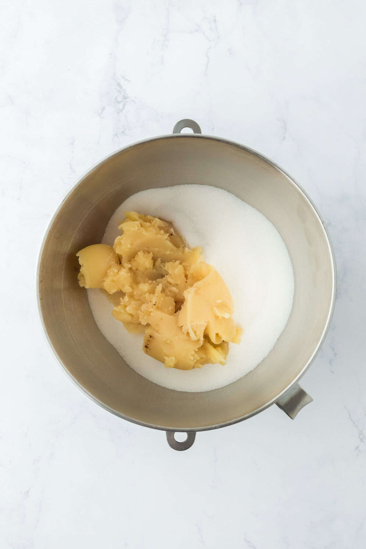 cold brown butter with sugar in a bowl of a stand mixer