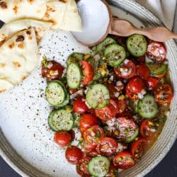 Whipped feta with tomato salad and pita bread for dipping.