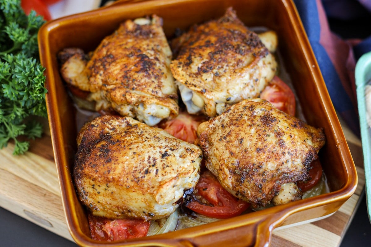 oven baked chicken thighs hot from the oven.