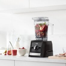 a vitamix ascent a2500 blender sits on a white kitchen countertop