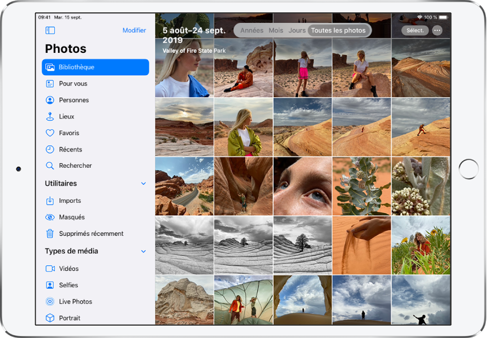Sur le côté gauche d’un écran de Photos se trouve une barre latérale permettant de sélectionner Photothèque, « Pour vous », Personnes, Lieux et d’autres catégories. L’option Photothèque est sélectionnée. Le reste de l’écran montre la photothèque dans la présentation « Toutes les photos ». La date et l’emplacement des photos prises se trouvent en haut de la photothèque. En haut au centre se trouvent les options d’affichage des photos : Années, Mois, Jours et « Toutes les photos » ; l’option « Toutes les photos » est sélectionnée. En haut à droite de l’écran se trouvent les boutons Aspect, Sélectionner et Plus.