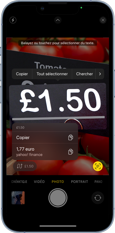 L’écran « Appareil photo » affichant le bouton d’action rapide permettant de convertir une devise affichée dans le cadre de l’appareil photo.