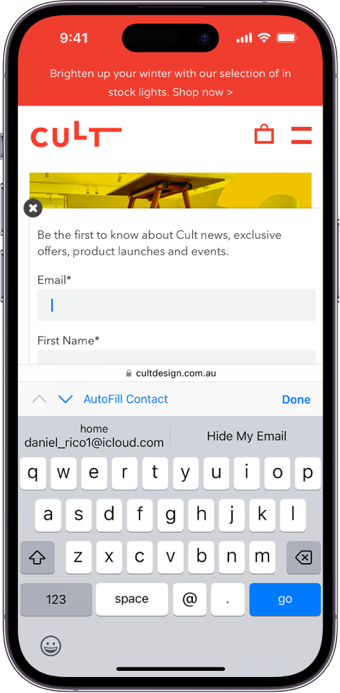 A website is open to a contact page, and an email address is being added. The keyboard is open. Above the keyboard, AutoFill has two options: add a real email or create a new Hide My Email for this website.