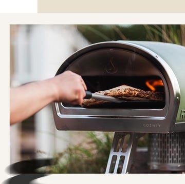 a person putting food in a grill